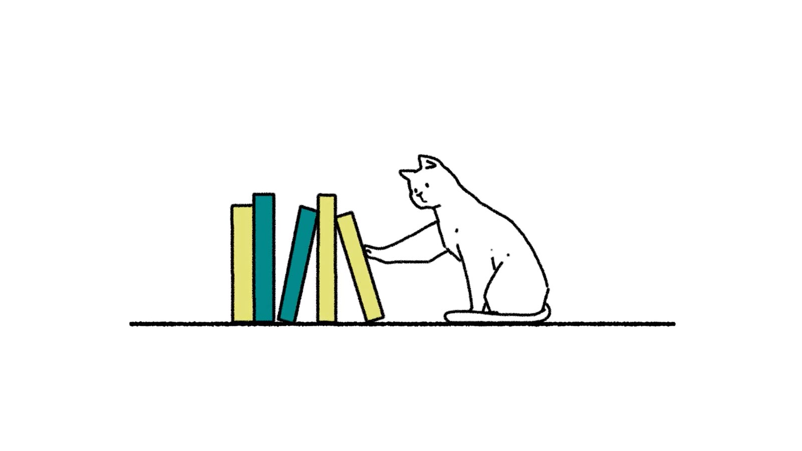 本に興味をもつ猫